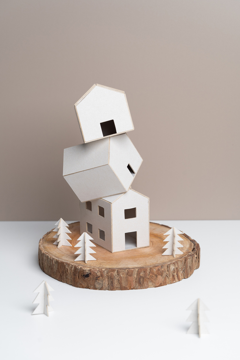 Stack of Cardboard and Paper Trees on Wooden Podium