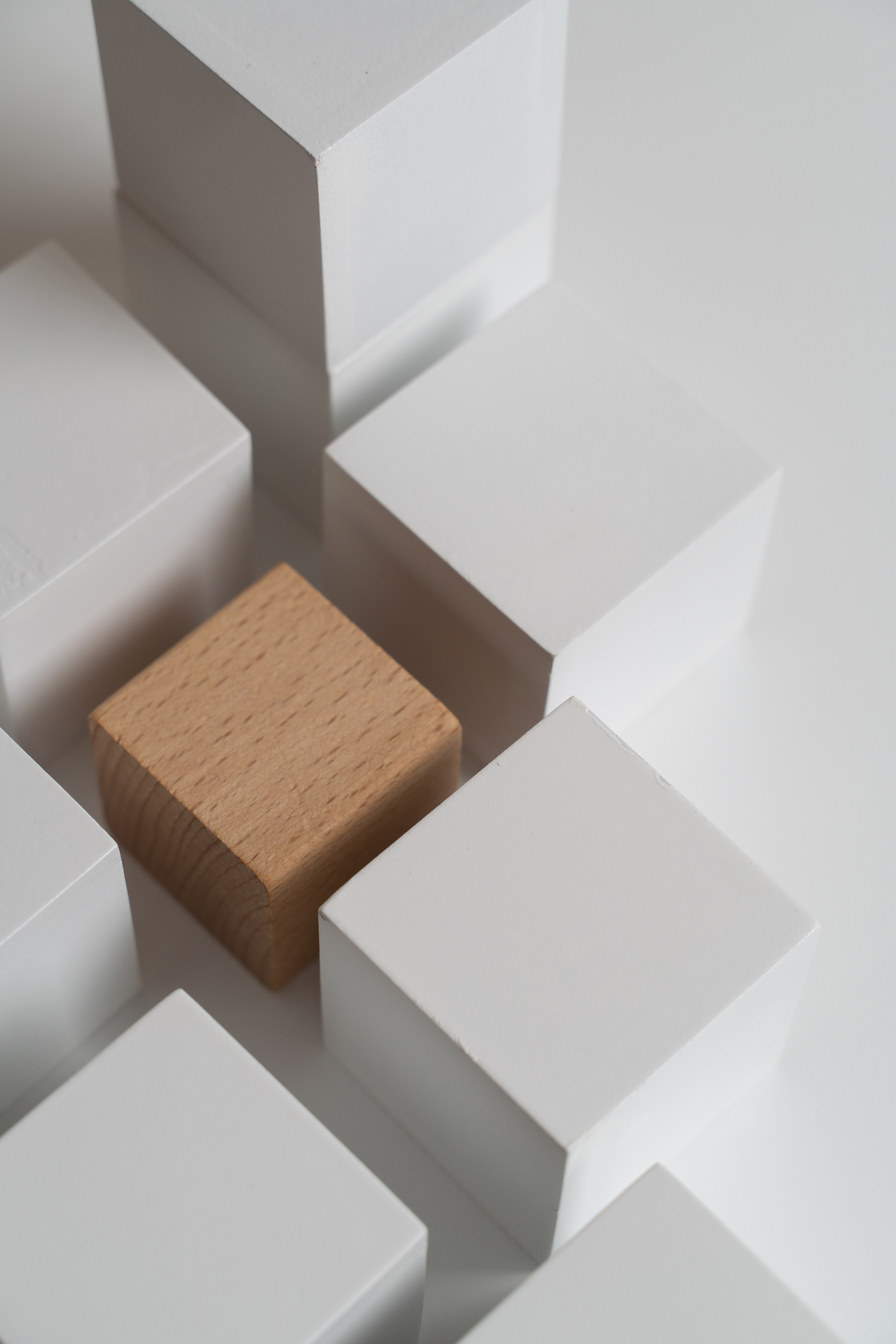 Wooden Cube Surrounded by White Squares